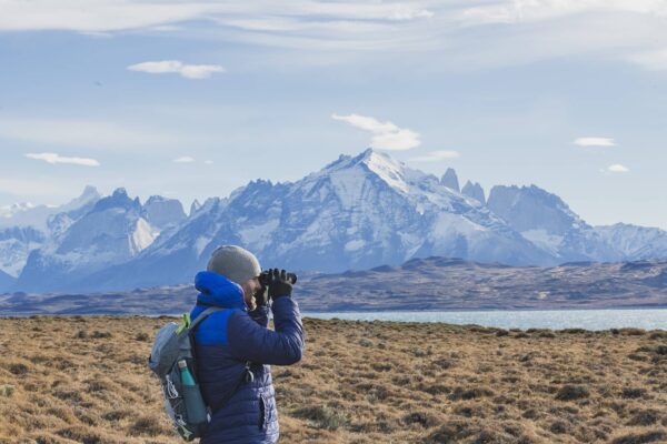 Man birdwatching on Tierra Patagonia Hotel excursion in Torres del Paine.